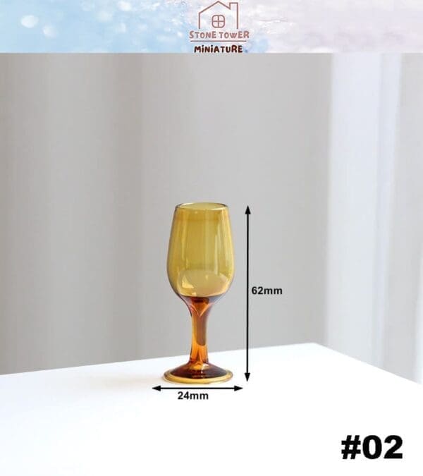 Amber miniature glass goblet with dimensions: 62mm tall, 24mm wide. Placed on a white surface, labeled #02.