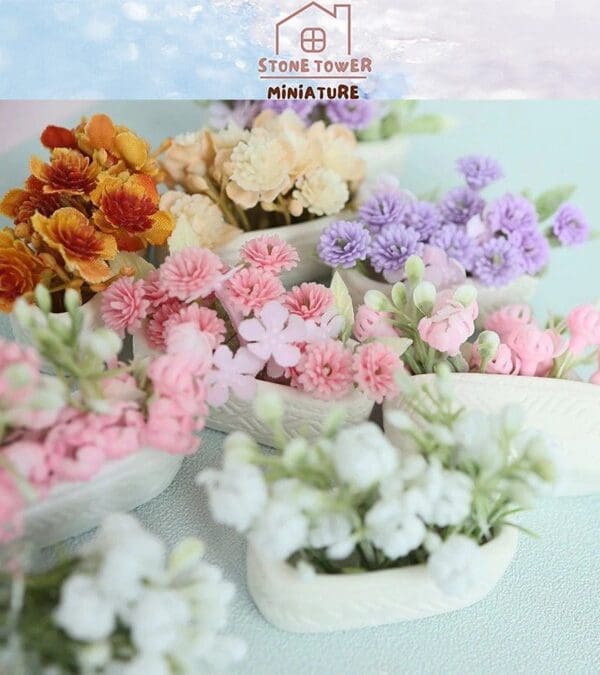 Miniature pastel flowers in white containers on a light blue surface, featuring shades of pink, purple, orange, and white.