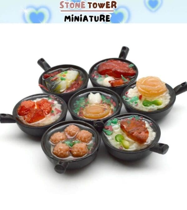 Assorted miniature clay food dishes in tiny black pots with colorful toppings, labeled "Stone Tower Miniature.