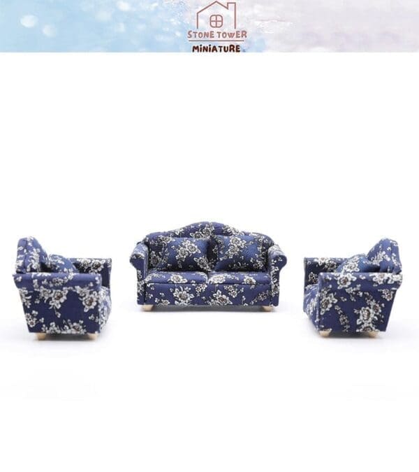 Miniature blue floral sofa set with a couch and two chairs on a white background.