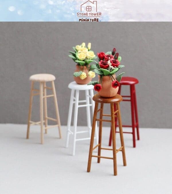 Four miniature stools with clay flower pots, featuring yellow and red blossoms, displayed on a gray background.