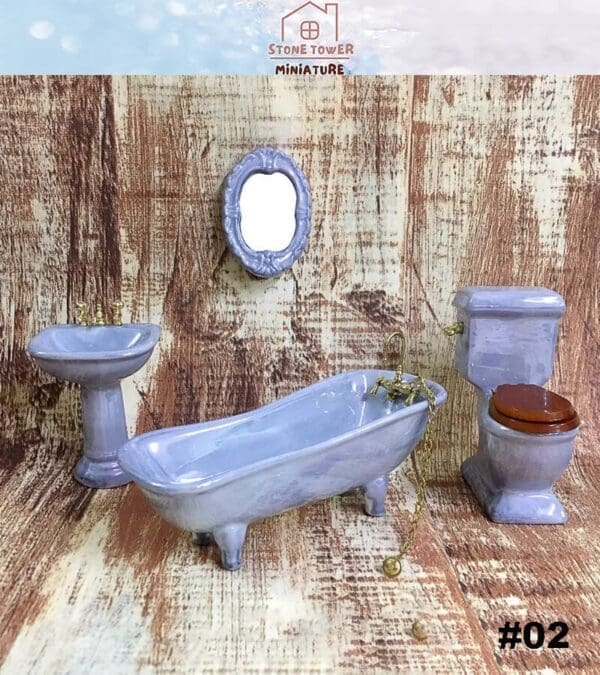 Miniature bathroom set with bathtub, pedestal sink, toilet, and wall mirror on a wood-textured background.