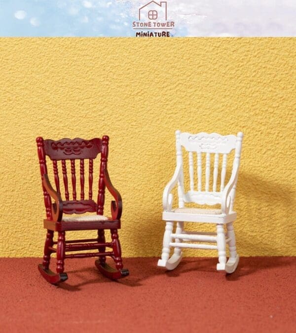 Two miniature rocking chairs, one red and one white, against a yellow textured background.