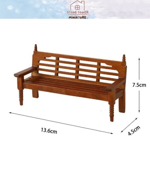 Miniature wooden bench, dimensions 13.6cm x 7.5cm x 4.5cm, with a slatted backrest and armrests.