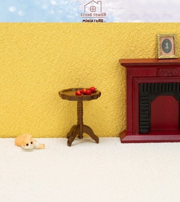 Miniature room with a wooden table holding red berries, a red fireplace, and a small cat figurine on a light floor.