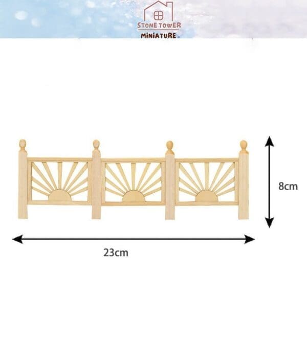 Wooden fence miniature with sunburst design, measuring 23cm in length and 8cm in height.