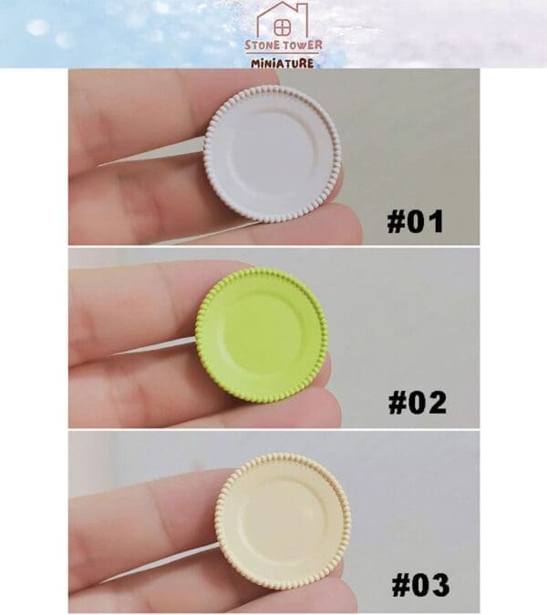 Three miniature round plates in white, green, and beige, marked #01, #02, and #03, held between fingers.