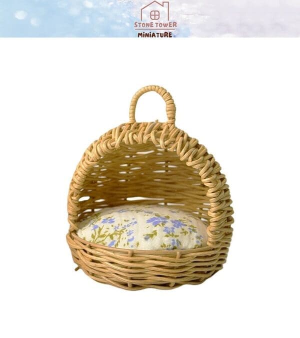 Woven basket with a floral cushion inside, featuring a curved handle on top against a plain background.