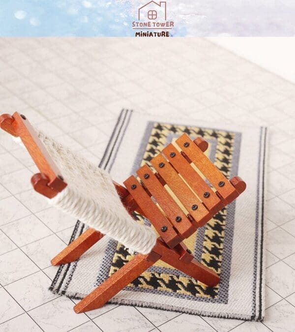 Miniature wooden chair on a patterned rug with a white background.