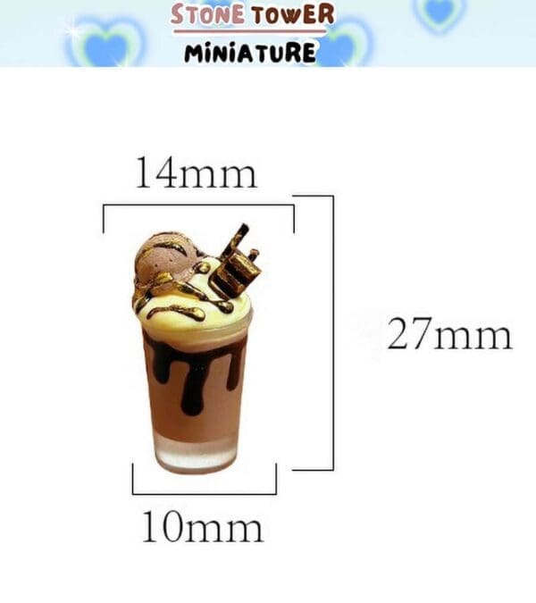 Miniature dessert in a glass, measuring 14mm by 27mm, with whipped cream, chocolate drizzle, and a chocolate straw.