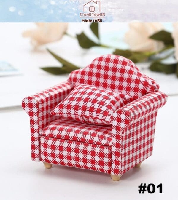 Miniature red and white checkered armchair with matching pillow on a white surface.