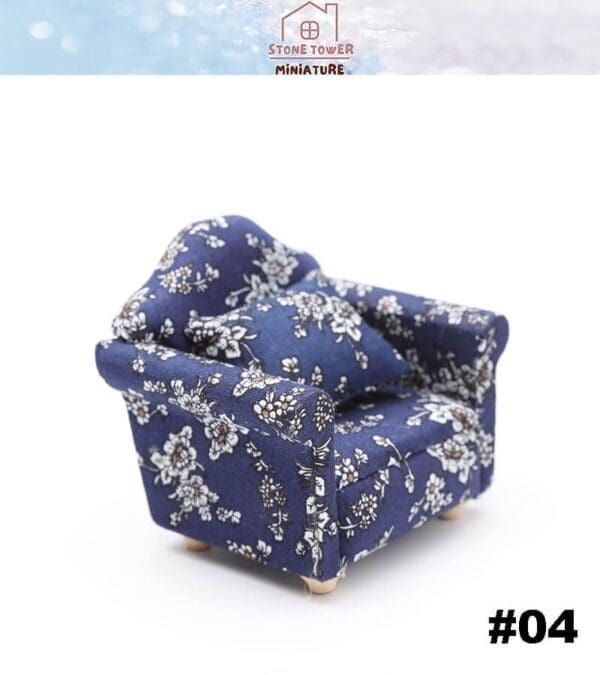 Miniature floral-patterned armchair in navy blue, featuring a matching cushion. Item labeled as #04.