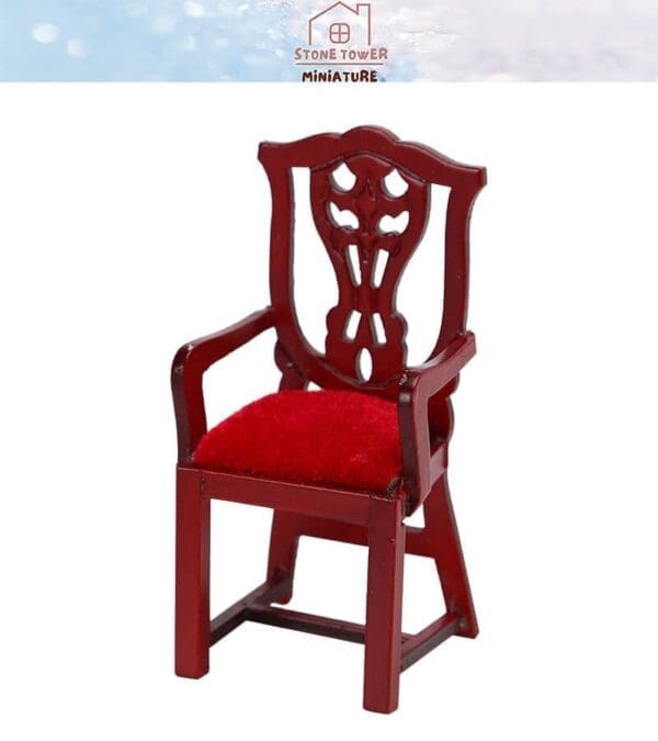 Miniature red wood chair with intricate backrest and red velvet seat.