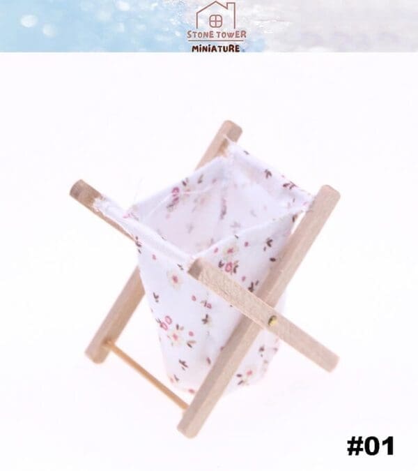 Miniature wooden clothes rack with floral cloth, displayed on a white background, labeled #01.