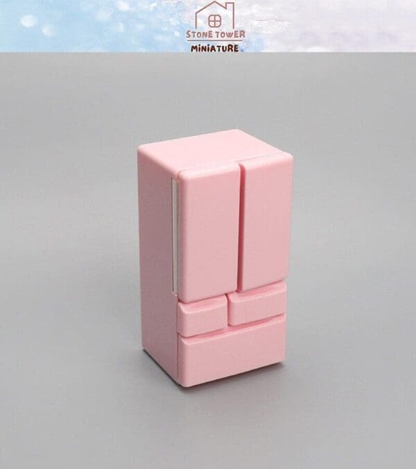 Pink miniature refrigerator on a gray background, shown with a logo reading "Stone Tower Miniature" at the top.