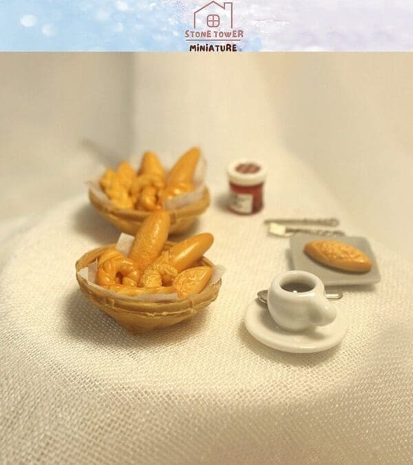 Miniature baskets with bread, a small coffee cup, a jar, and bread on a plate on a textured white surface.