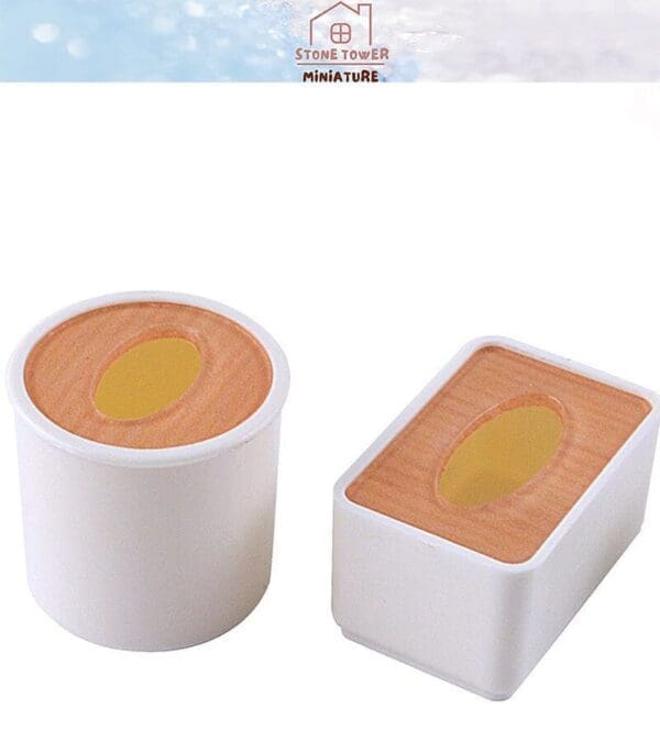 Two miniature white containers with wooden tops and circular cutouts.