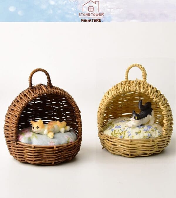 Two miniature wicker baskets with plush cats on floral cushions, one brown and white, one black and white.