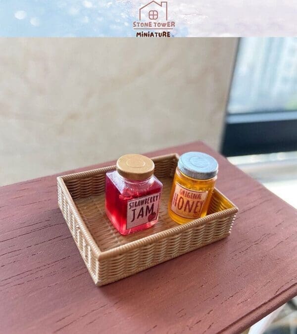 Miniature jars of strawberry jam and honey in a small woven basket on a wooden surface.