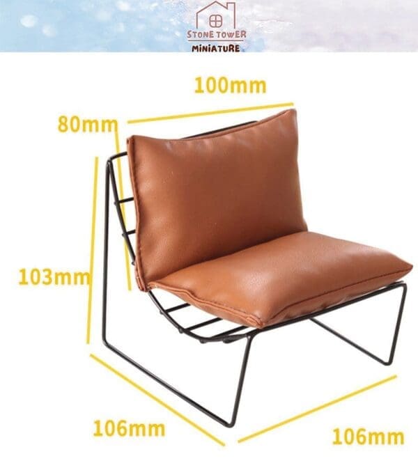 Brown miniature chair with black metal frame, featuring dimensions: 100mm wide, 80mm high, 103mm back height, 106mm depth.