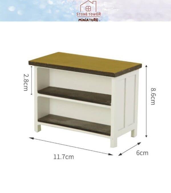 Miniature white wooden shelf with dimensions: 8.6cm high, 11.7cm wide, and 6cm deep. Two shelves are included.