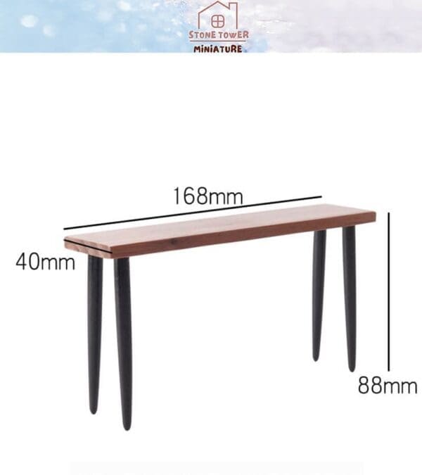 Miniature bench with wooden top, black legs; dimensions 168mm x 40mm x 88mm, suitable for dollhouses or dioramas.