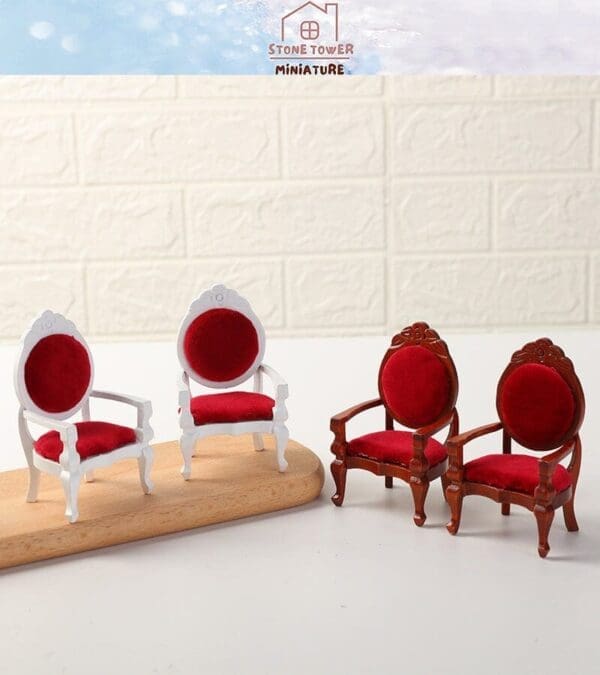 Four miniature chairs with red cushions, two white and two brown, displayed on a white surface with a textured backdrop.