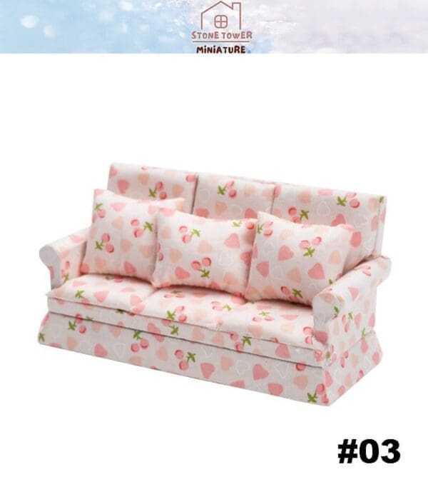 Miniature pink sofa with strawberry and heart pattern, three cushions; labeled "Stone Tower Miniature" and "#03".