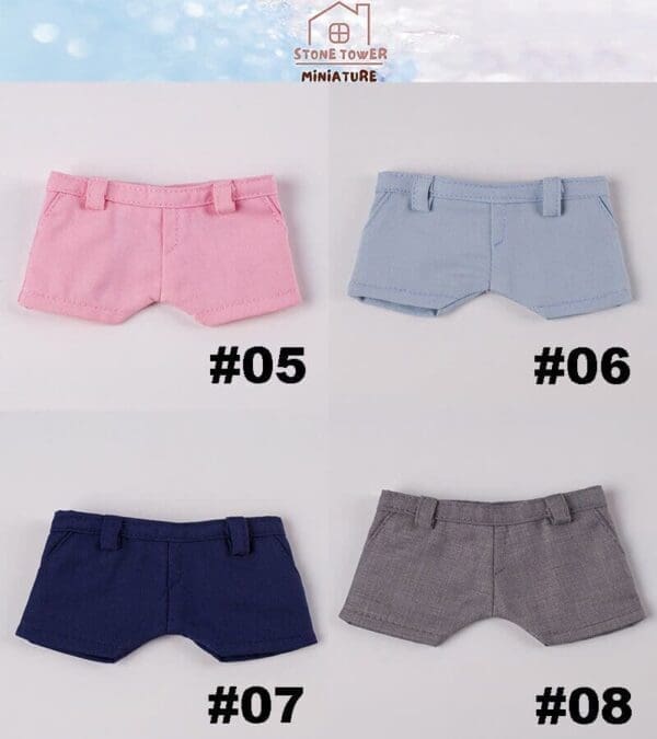 Four miniature shorts in pink, blue, navy, and gray with tags #05, #06, #07, and #08 displayed on a white background.