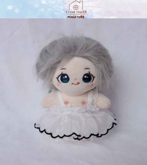 Cute plush doll with gray hair and a white frilly dress, with "Stone Tower Miniature" logo above.