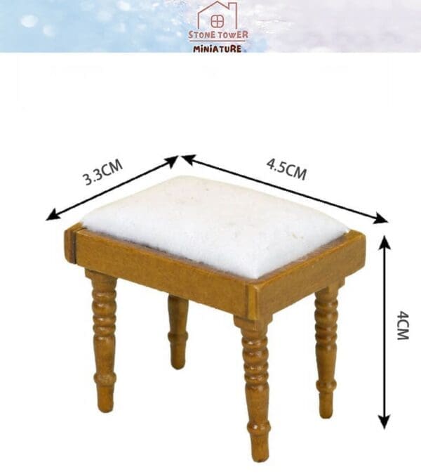 Miniature wooden stool with white cushion, measuring 4.5 cm by 3.3 cm by 4 cm, from Stone Tower Miniature.