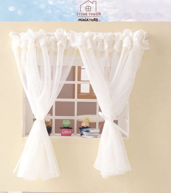 Miniature window with white lace curtains and small pots on the sill, each labeled "LOVE.