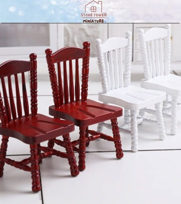 Four miniature wooden chairs, two red and two white, arranged on a white tiled surface.