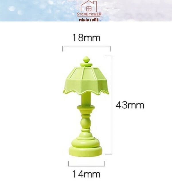 Green miniature lamp with scalloped shade, measuring 43mm tall, 18mm wide, and 14mm deep.