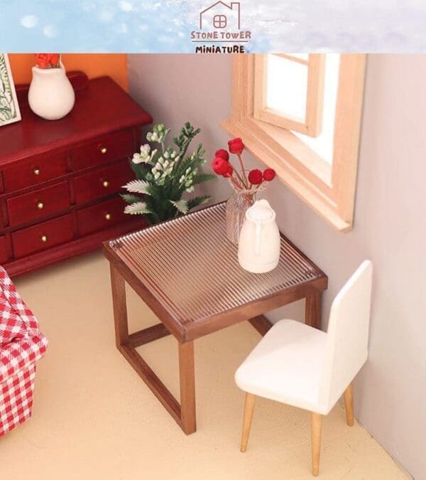 Miniature room scene with a wooden table, white chair, red dresser, and plants under a window.