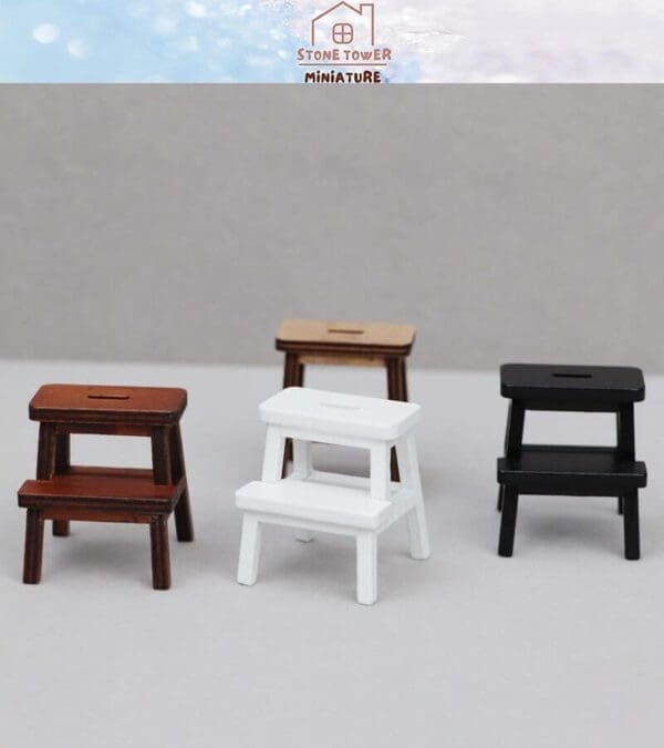 Four miniature stools in brown, white, black, and light wood on a gray background.