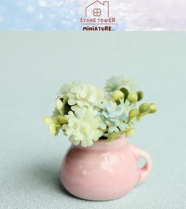 Miniature pastel flowers in a small pink vase on a light background.