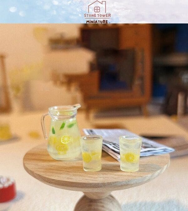 Miniature pitcher and glasses of lemonade on a wooden table, with a newspaper in the background.