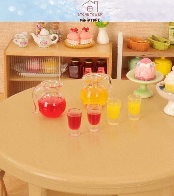 Miniature tea set and pastries on a table with pitchers of red and yellow drinks in front.