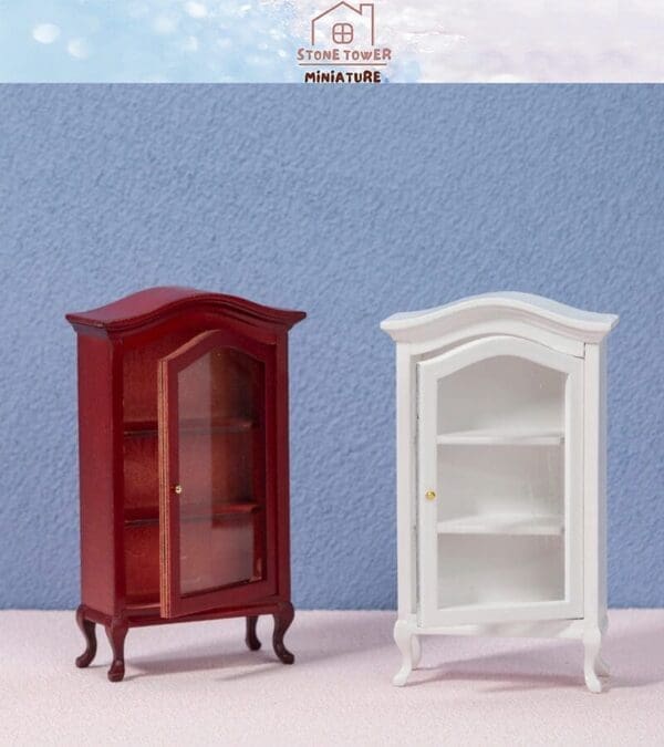 Two miniature display cabinets, one red and one white, on a textured pastel surface with a light blue background.