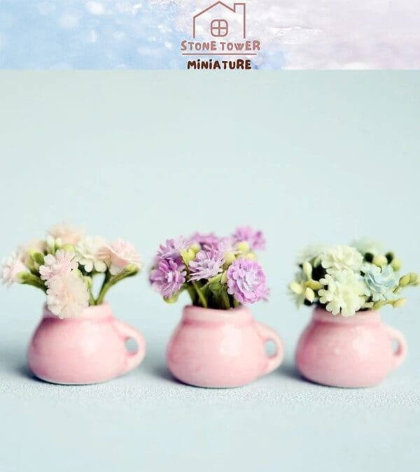 Three miniature pink mugs with pastel flowers against a light blue background, featuring "Stone Tower Miniature" text.