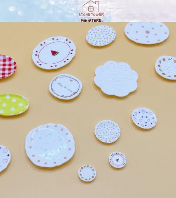 Assorted miniature ceramic plates with colorful patterns on a beige background.