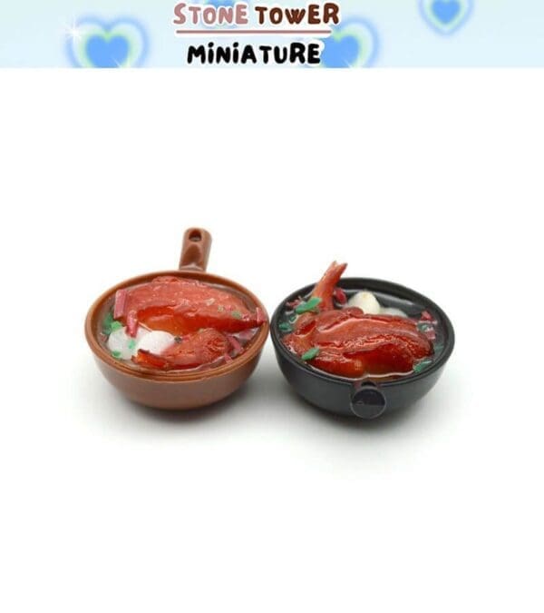 Two miniature bowls of realistic reddish-orange food on a white background.